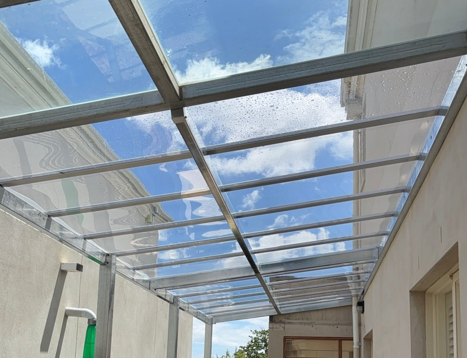 Steeel frame pergola with glass like roofing